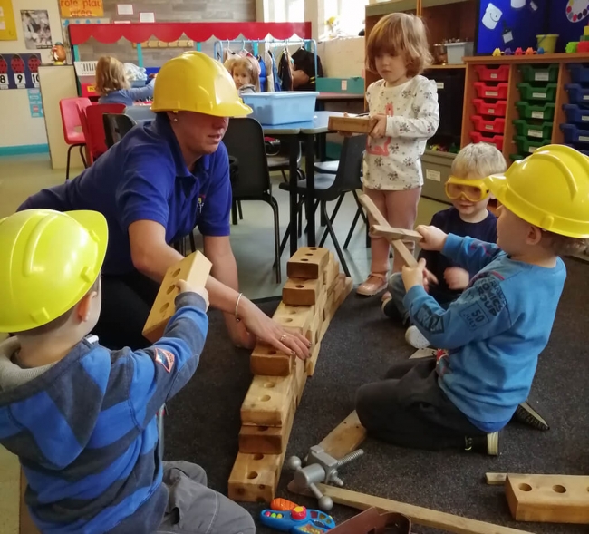Children playing in the Butterfly room – builders